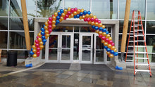 Load image into Gallery viewer, Gold, sapphire blue, and ruby red spiral arch by Vancouverballoons