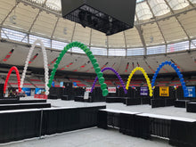 Load image into Gallery viewer, Multiple pearl string arches in white, red, green, purple, yellow, blue, filled with helium and created by Vancouver Balloons