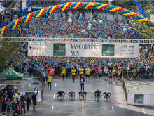 Load image into Gallery viewer, Giant helium spiral arch for Vancouver Sun Run event by Vancouver Balloons