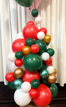 Load image into Gallery viewer, A vibrant Christmas Tree Balloon Column designed with a mix of red, green, white, and metallic gold balloons of various sizes. The balloons are clustered tightly to create a tree-like shape, with larger balloons forming the base and smaller balloons interspersed to add texture and depth. Metallic gold and green balloons add a festive shimmer, while red and white balloons provide a classic Christmas color scheme.
