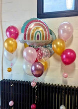 Load image into Gallery viewer, A bouquet of balloons featuring a large rainbow-shaped balloon, with a mix of round balloons in colors gold, pink, white, and magenta, along with heart-shaped balloons in pink.
