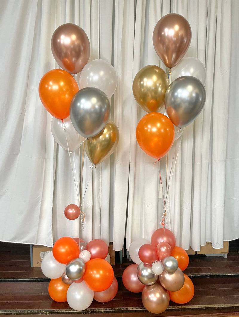 balloon bouquets in orange and pink with organic base at the bottom5