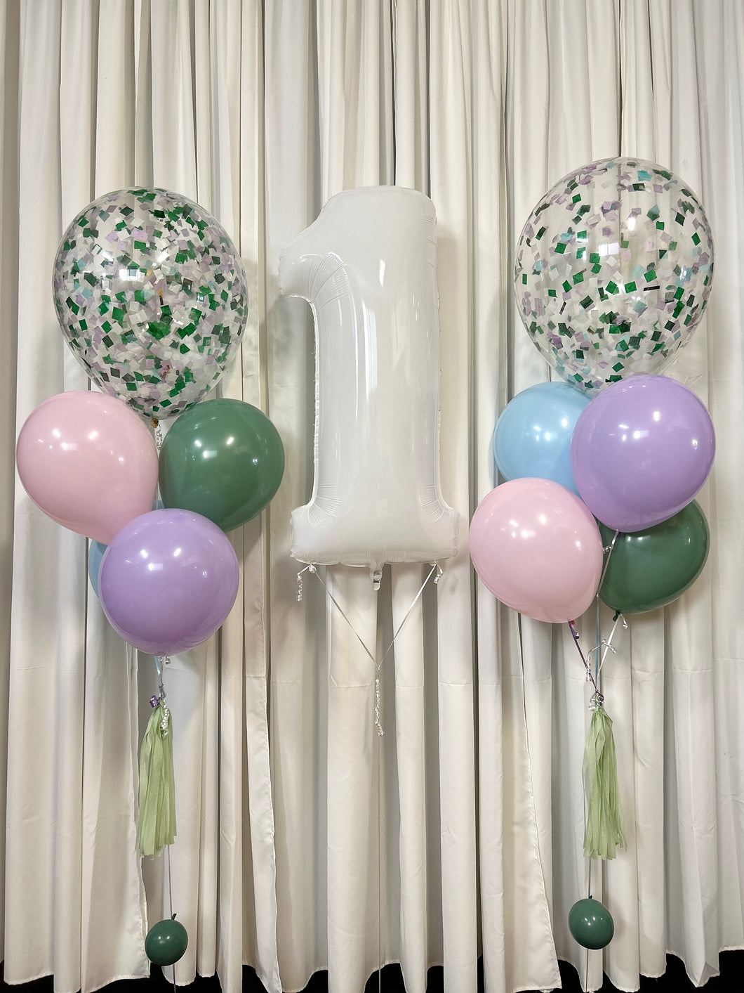 white number balloon with balloon bouquets of confetti balloons and pastel colour balloons