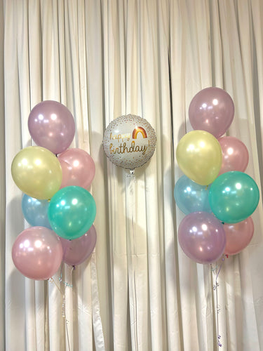 pastel coloured balloon bouquets with rainbow birthday mylar balloon 