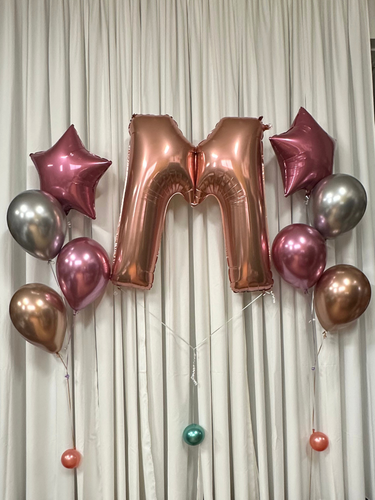rose gold megaloon letter with star foil balloon bouquet