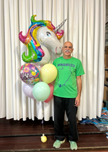 Load image into Gallery viewer, Soft Pastel Rainbow Unicorn Birthday Balloon Package with a man
