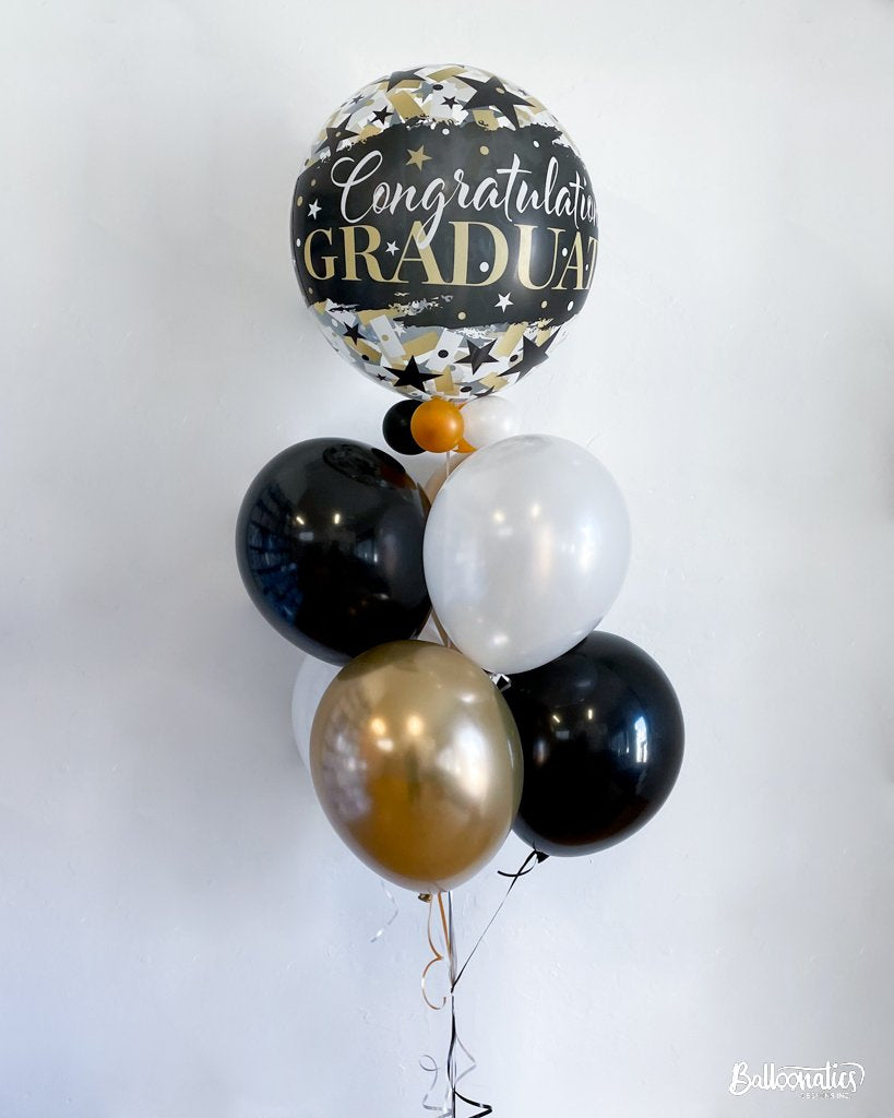 balloon bouquet with congratulations graduate bubble balloon and black and gold balloons