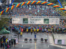 Load image into Gallery viewer, Giant helium spiral arch for Vancouver Sun Run event by Vancouver Balloons
